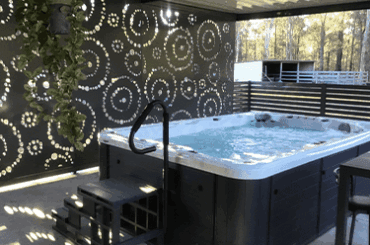 Decorative screening by a large hot tub Decorative screening by a large hot tub