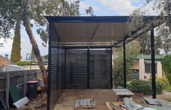 Freestanding carport with privacy screening