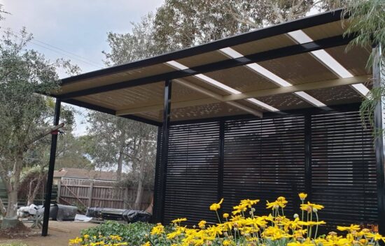 Freestanding carport with privacy screening