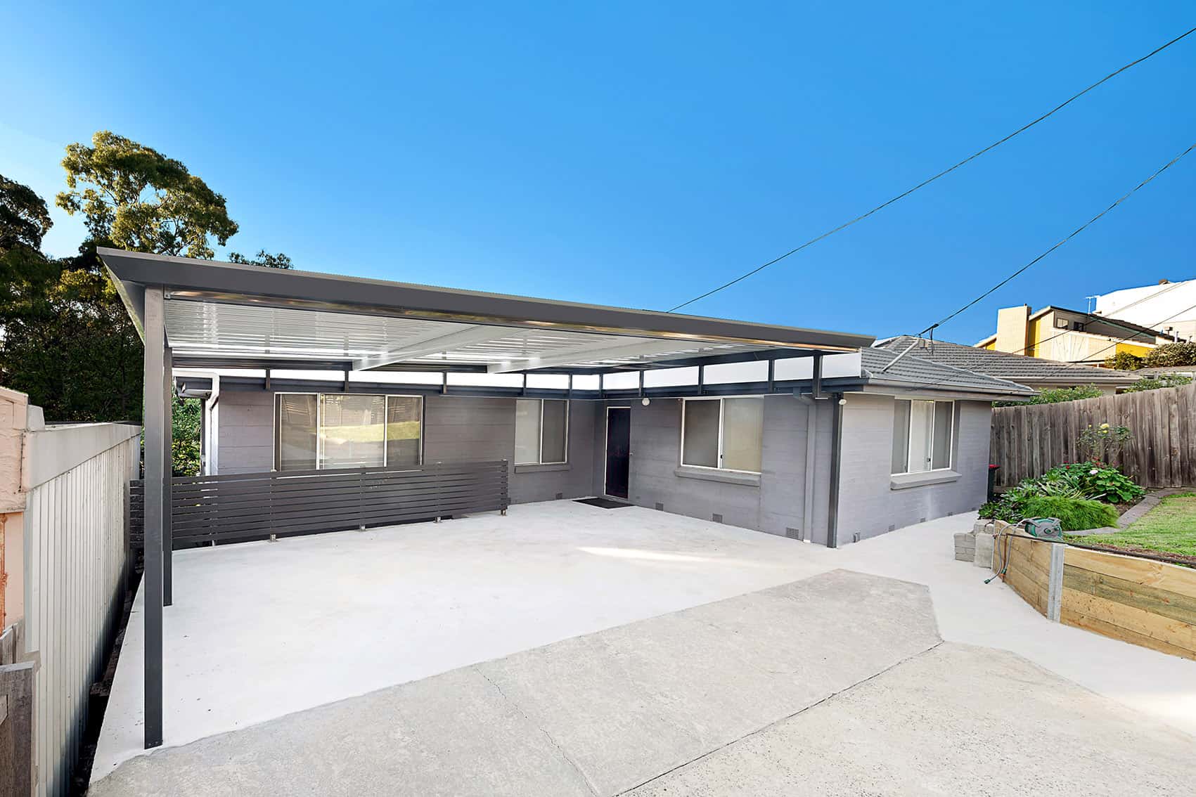 Home with a flat roof carport